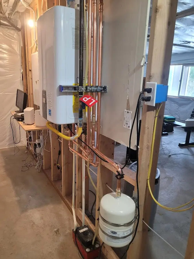 Licensed plumber repairing a kitchen sink in Walton